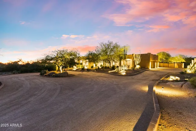 a spacious bedroom with a bed and ceiling fan
