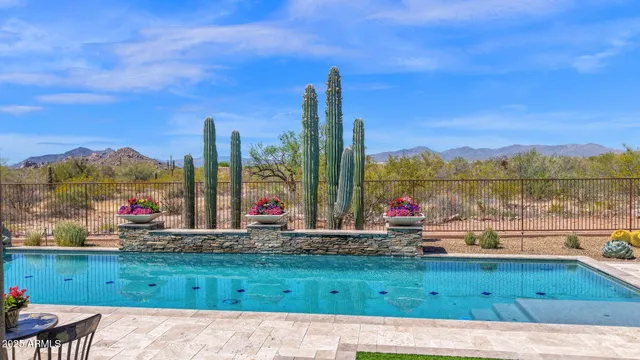a view of a patio with swimming pool table and chairs