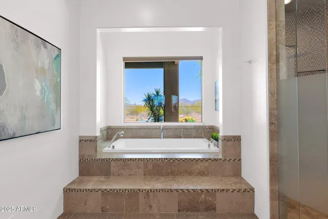 a terrace with outdoor seating and city view