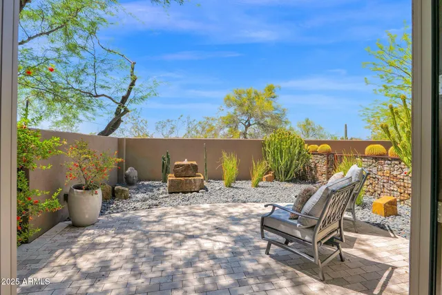 a bedroom with furniture and a window