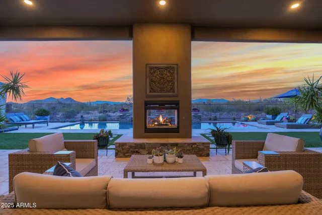 a living room with a bed furniture and a window