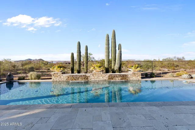 a dining room with furniture a chandelier and wooden floor