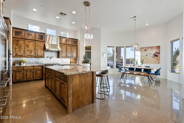 a view of a lake with a table and chairs