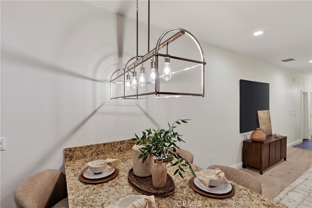 236 Montage Drive Merced, CA 95348 - Photo 11 of 36 a table with chairs and a potted plant