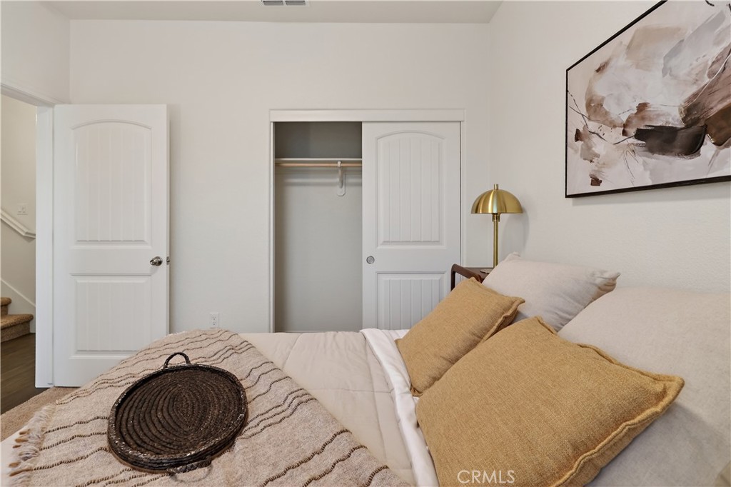 236 Montage Drive Merced, CA 95348 - Photo 13 of 36 a bedroom with a bed and a painting on the wall