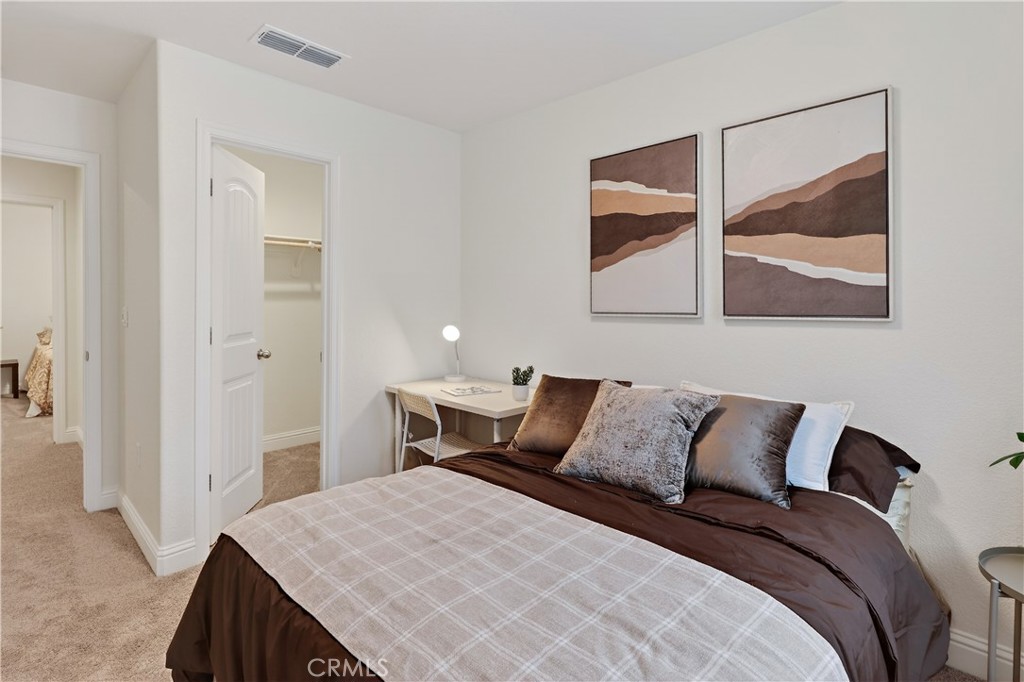 236 Montage Drive Merced, CA 95348 - Photo 25 of 36 a bedroom with a bed and a painting on the wall