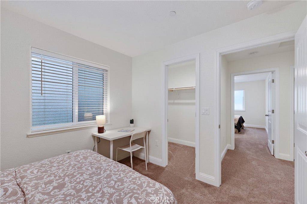 236 Montage Drive Merced, CA 95348 - Photo 27 of 36 a bedroom with a bed and a table in it