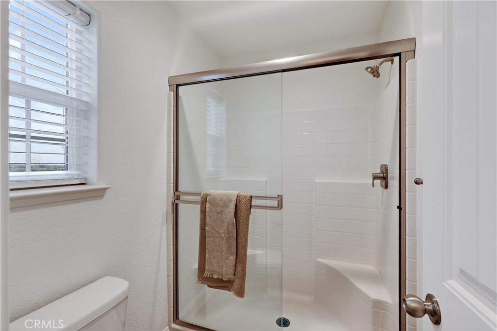 236 Montage Drive Merced, CA 95348 - Photo 33 of 36 a bathroom with a shower and toilet