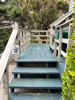 a front view of a house with stairs