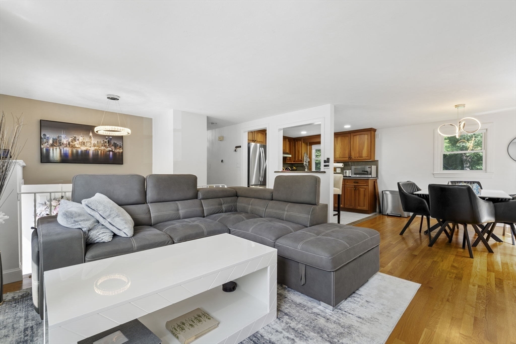 8 Governor Fuller Road Billerica, MA 01821 - Photo 12 of 33 a living room with furniture and a wooden floor