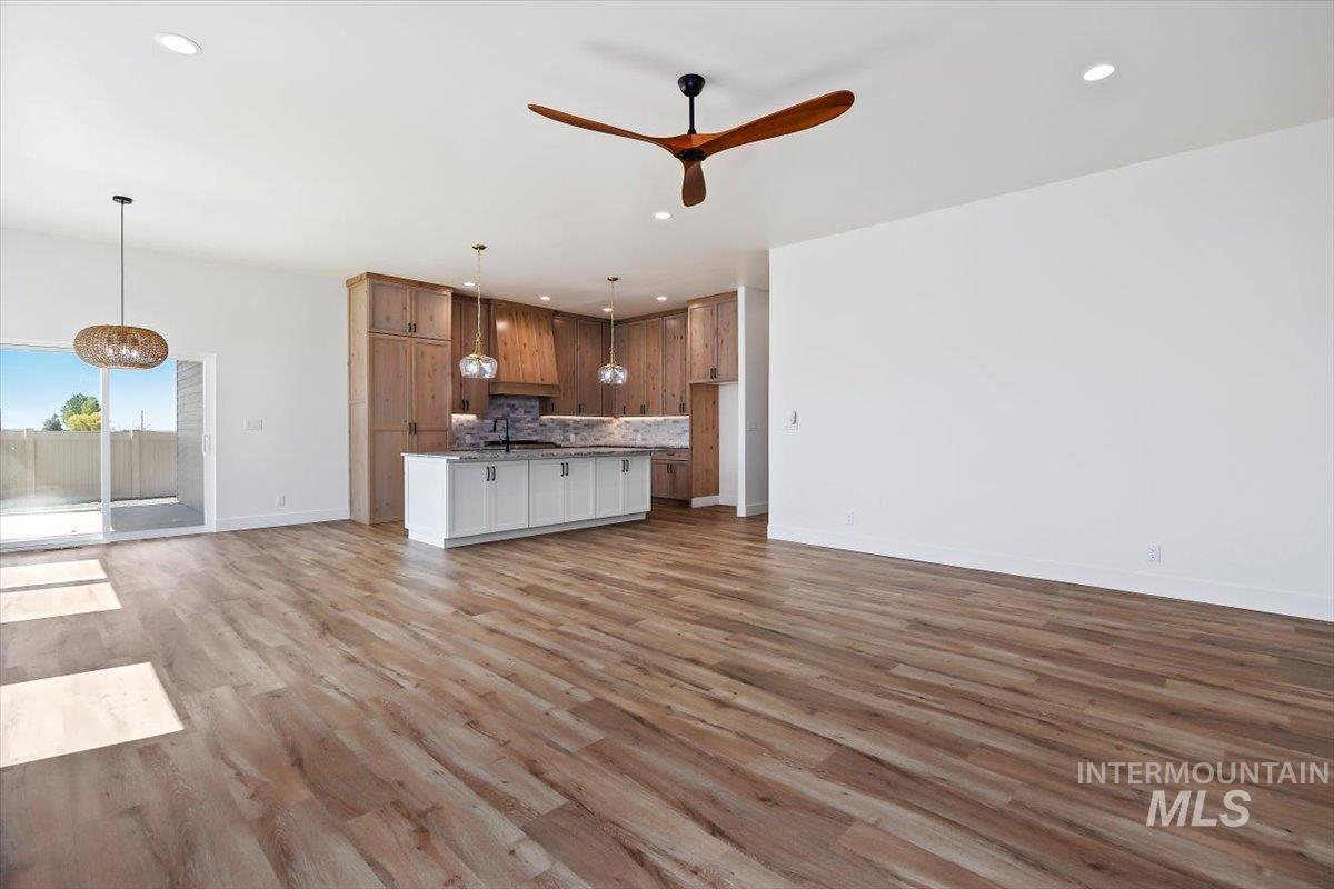 563 Moonstone Road Kimberly, ID 83341 - Photo 6 of 48 Open-concept living space with wood-finish flooring, recessed lighting, and a modern ceiling fan