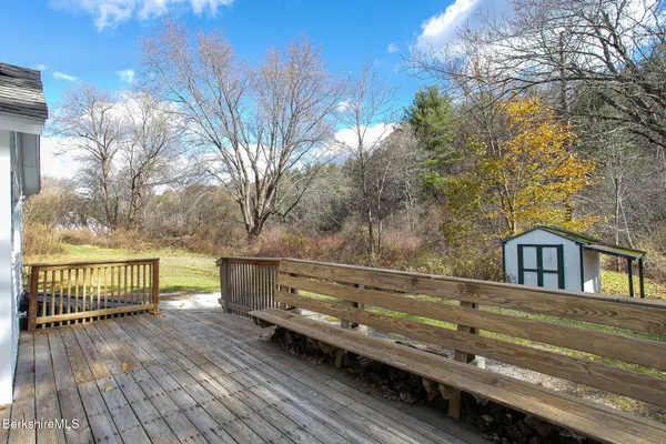 a view of outdoor space with deck and yard