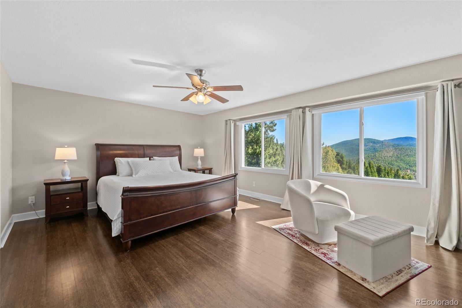 33633 Elk Run Evergreen, CO 80439 - Photo 19 of 39 a bedroom with a bed and a large window