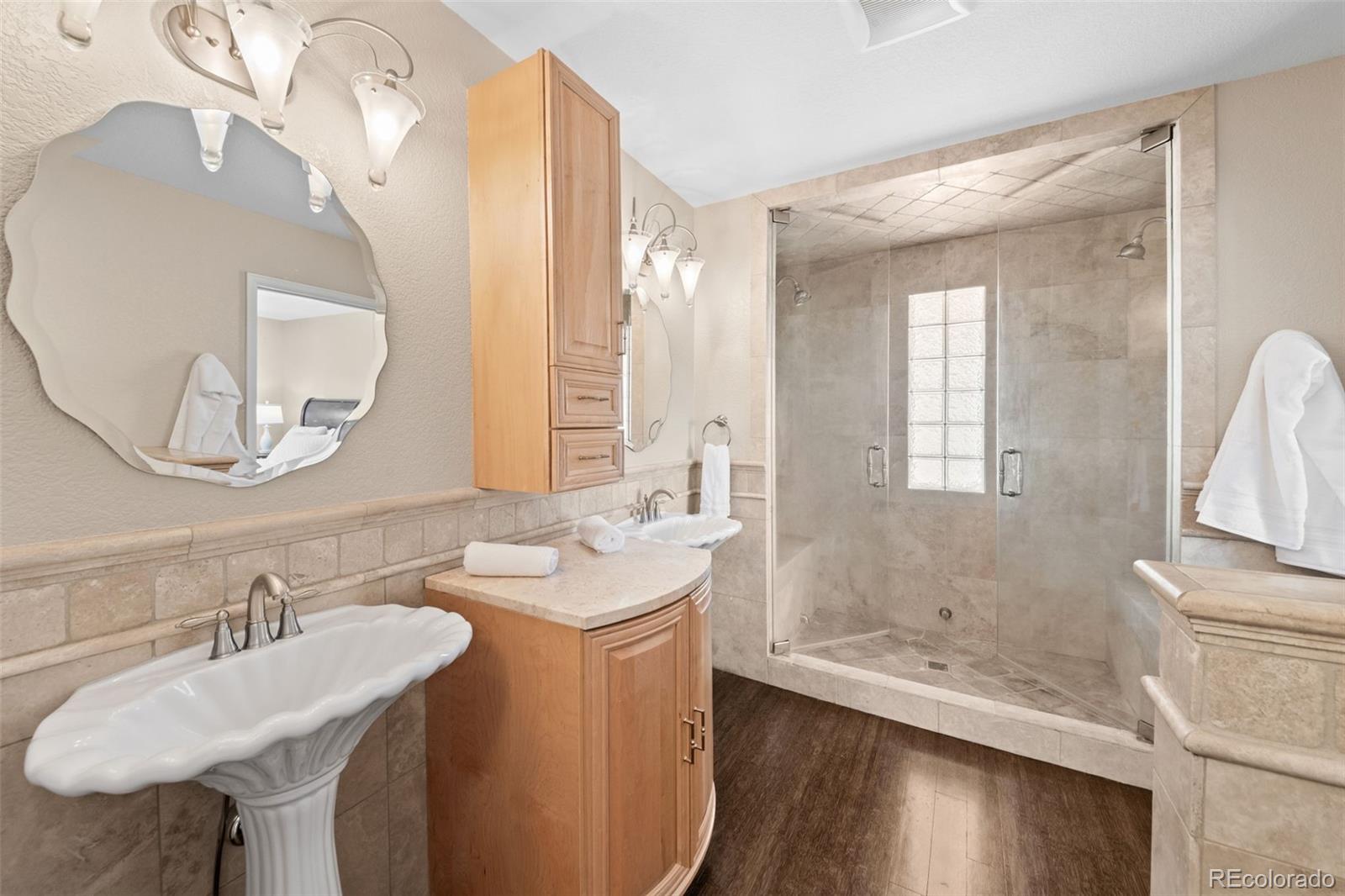33633 Elk Run Evergreen, CO 80439 - Photo 21 of 39 a bathroom with a sink and a mirror