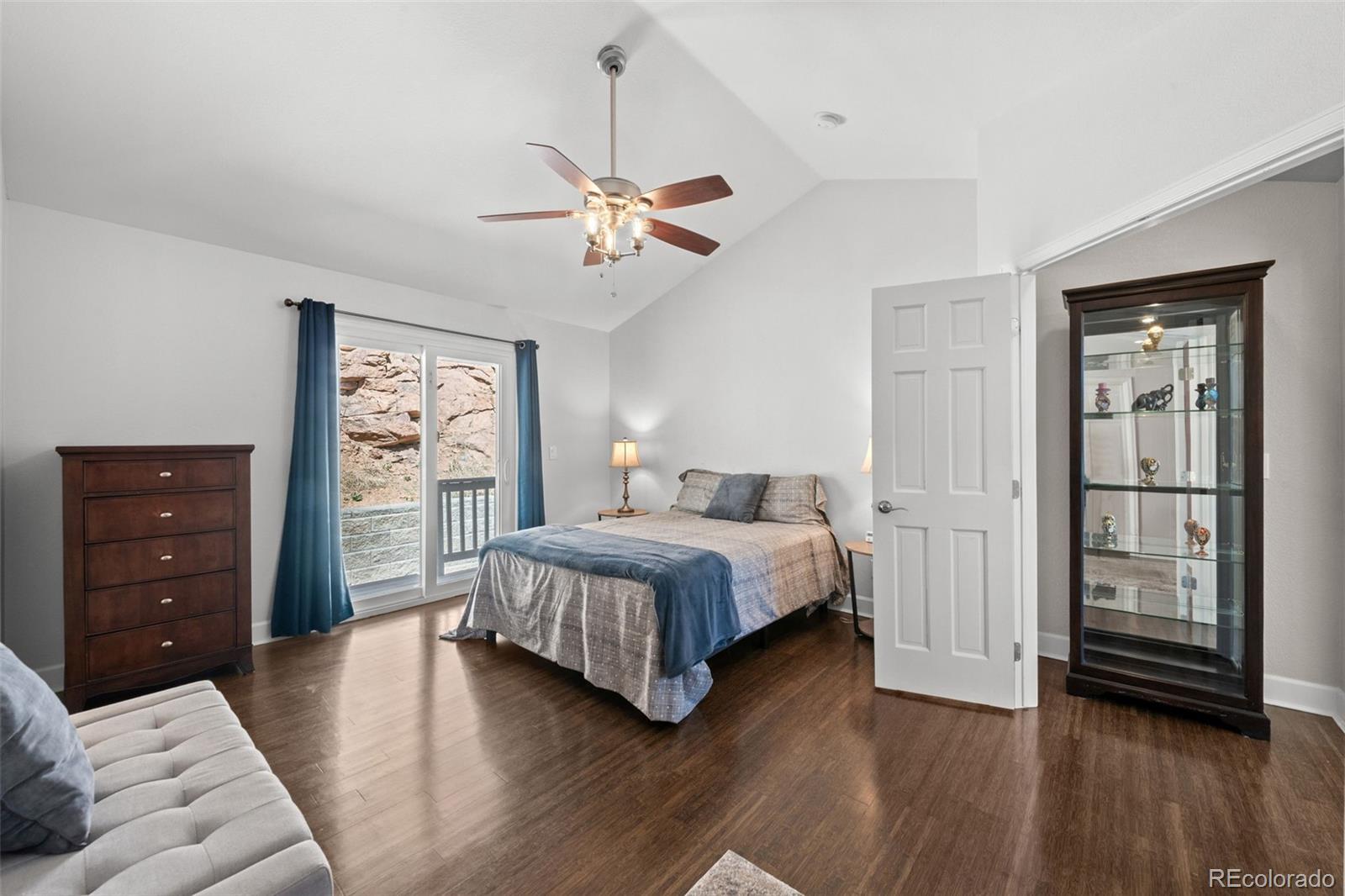 33633 Elk Run Evergreen, CO 80439 - Photo 25 of 39 a bedroom with a bed and a walk in closet