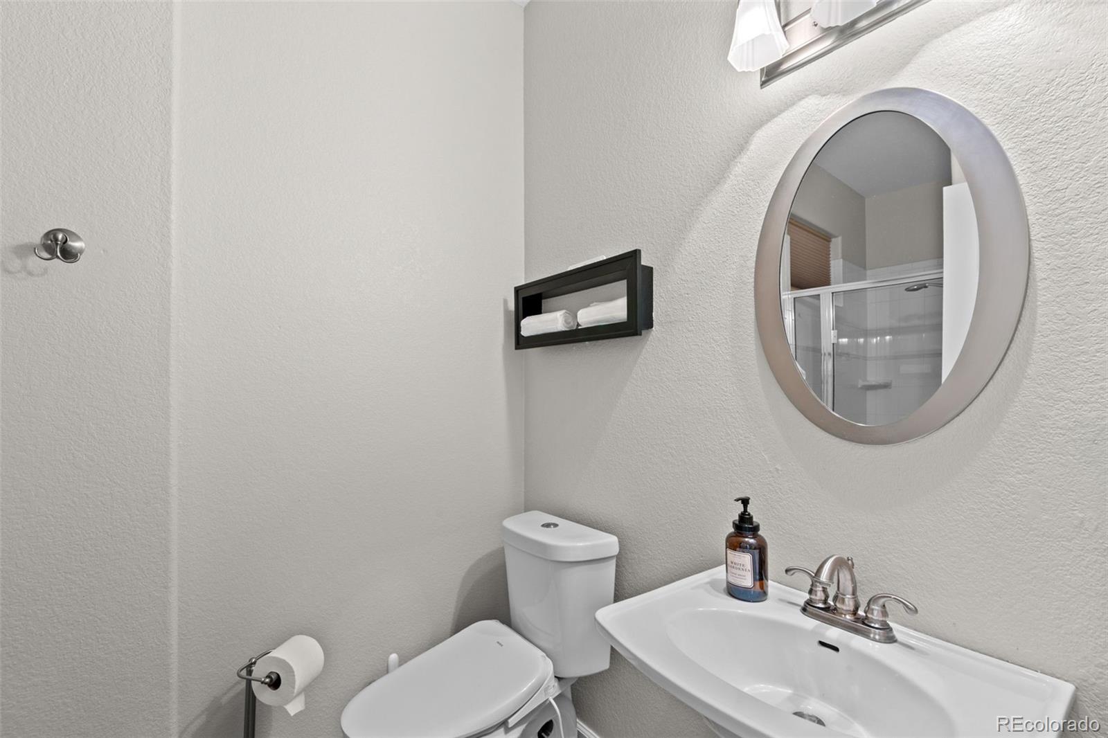 33633 Elk Run Evergreen, CO 80439 - Photo 31 of 39 a bathroom with a toilet and a sink