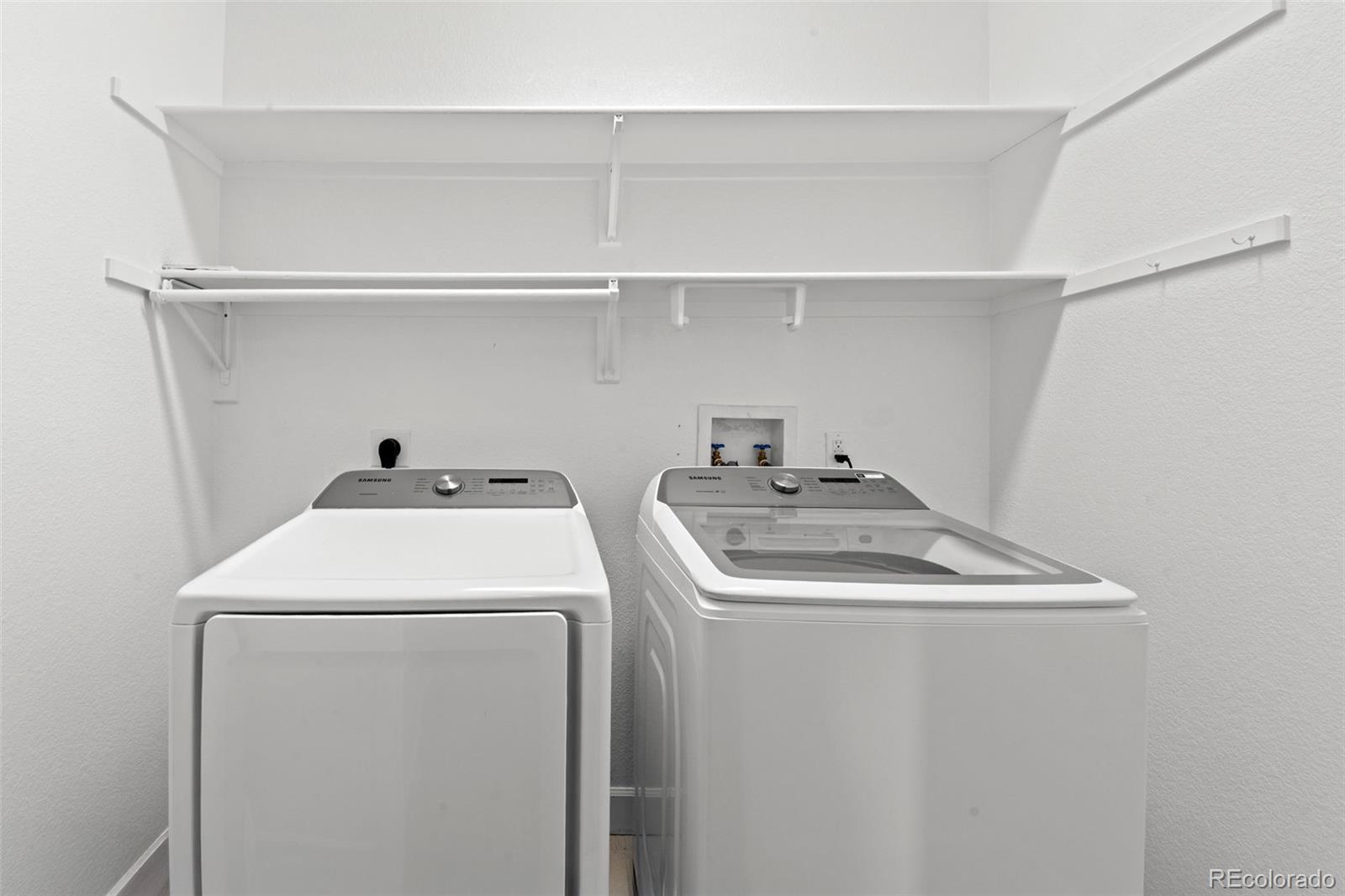 33633 Elk Run Evergreen, CO 80439 - Photo 32 of 39 a utility room with dryer and washer