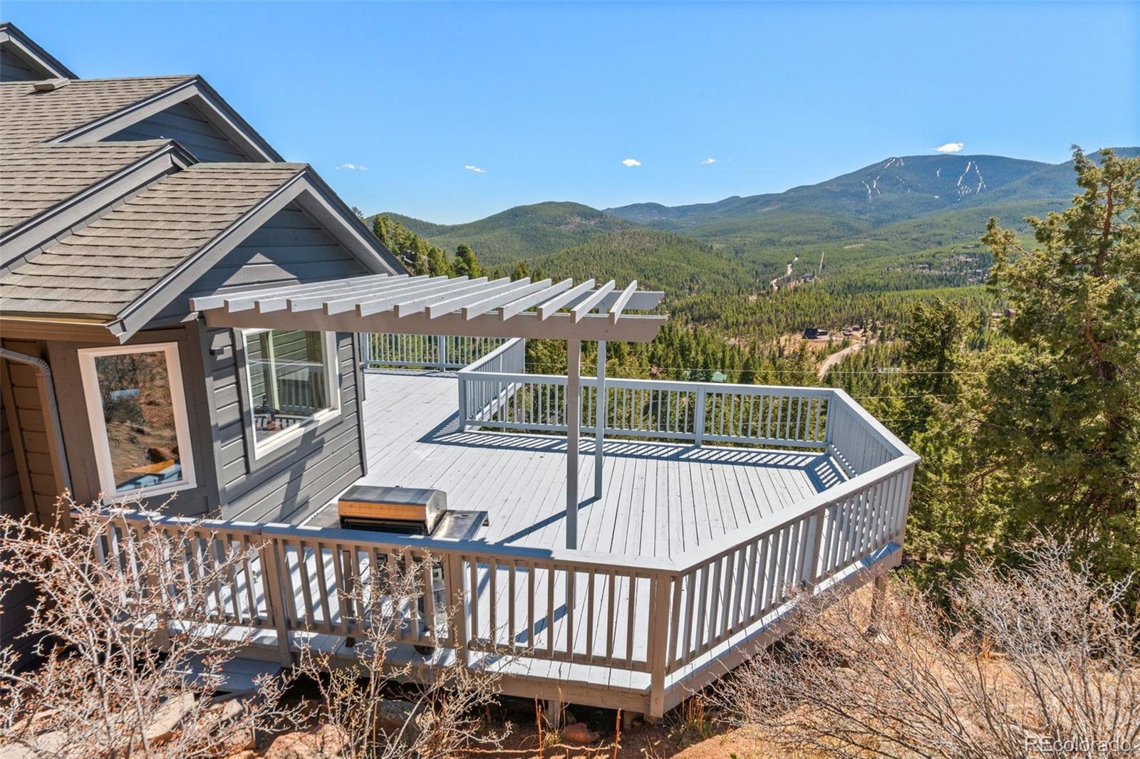 33633 Elk Run Evergreen, CO 80439 - Photo 33 of 39 a view of balcony with wooden floor and fence