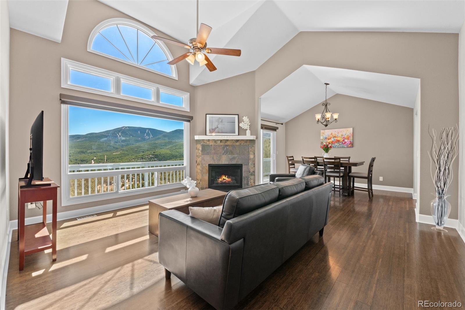 33633 Elk Run Evergreen, CO 80439 - Photo 4 of 39 a living room with furniture and a fireplace