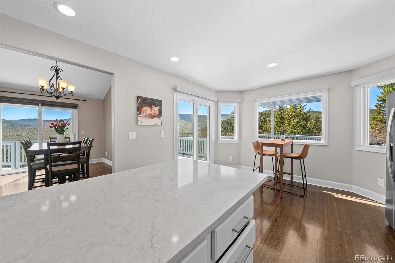 33633 Elk Run Evergreen, CO 80439 - Photo 10 of 39 a view of a dining room with furniture window and outside view