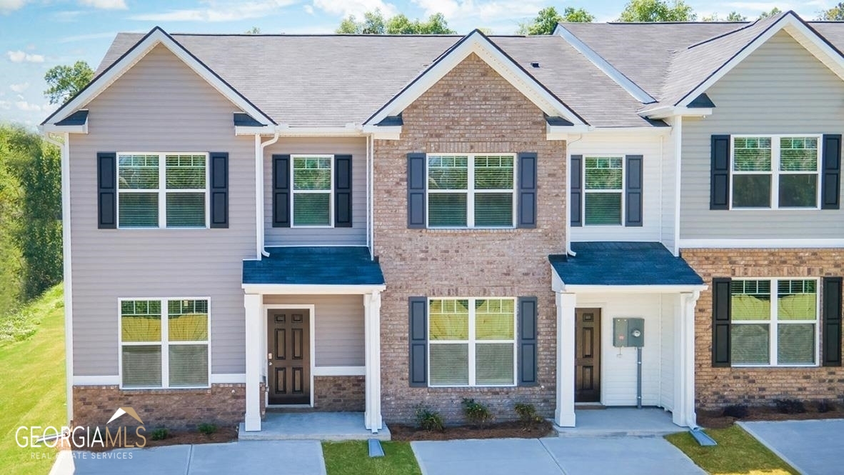 4289 Arcadia Drive, Unit 3 Decatur, GA 30034 - Photo 1 of 1 a front view of a house with a yard and potted plants