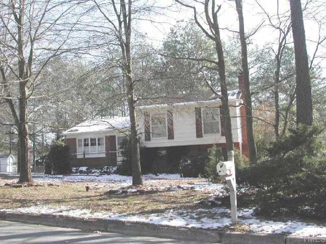 129 Montclair Circle Durham, NC 27713 - Photo 1 of 1 a front view of a house with a yard
