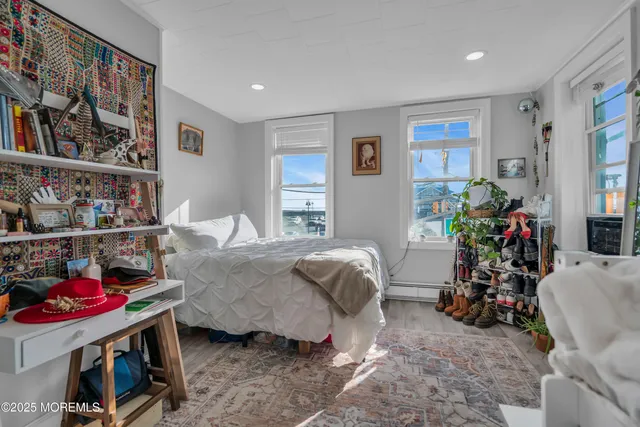 a bedroom with bed and a bookshelf