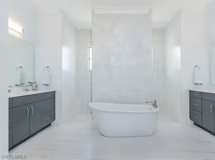 a bathroom with a bathtub sink mirror and toilet
