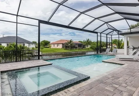 a view of a swimming pool with a patio