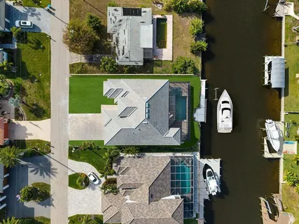 an aerial view of a house with a garden
