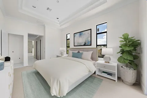 a bedroom with a bed and a couch