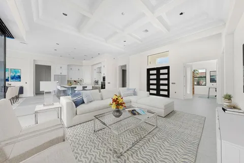 a living room with furniture white walls and white walls