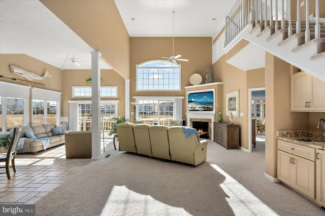 a kitchen with stainless steel appliances white cabinets and a stove top oven