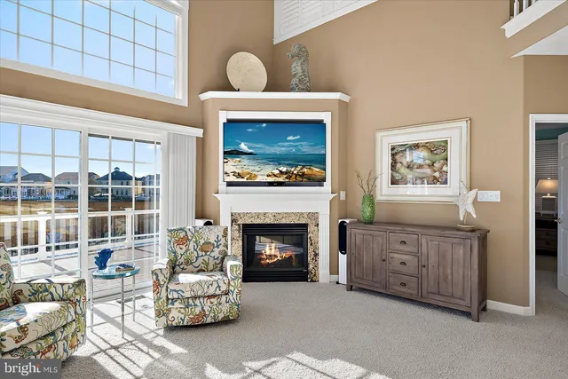 a large kitchen with stainless steel appliances granite countertop a stove a sink and white cabinets