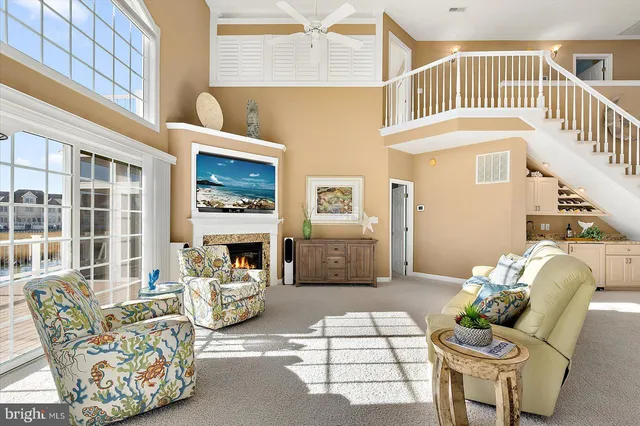 a dining room with furniture and a chandelier