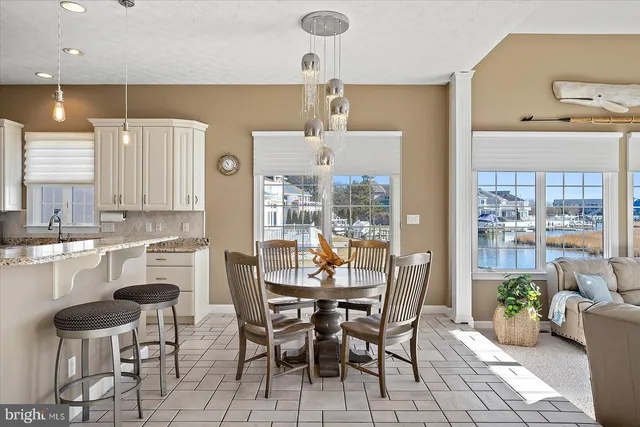 a front view of a house with garden and parking space