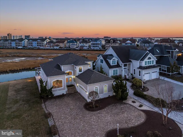a living room with furniture a fireplace and a large window
