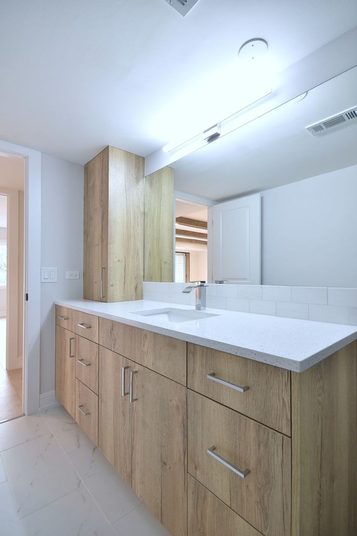 7314 Randolph Street, Unit 3G Forest Park, IL 60130 - Photo 11 of 15 a bathroom with a granite countertop sink and a mirror