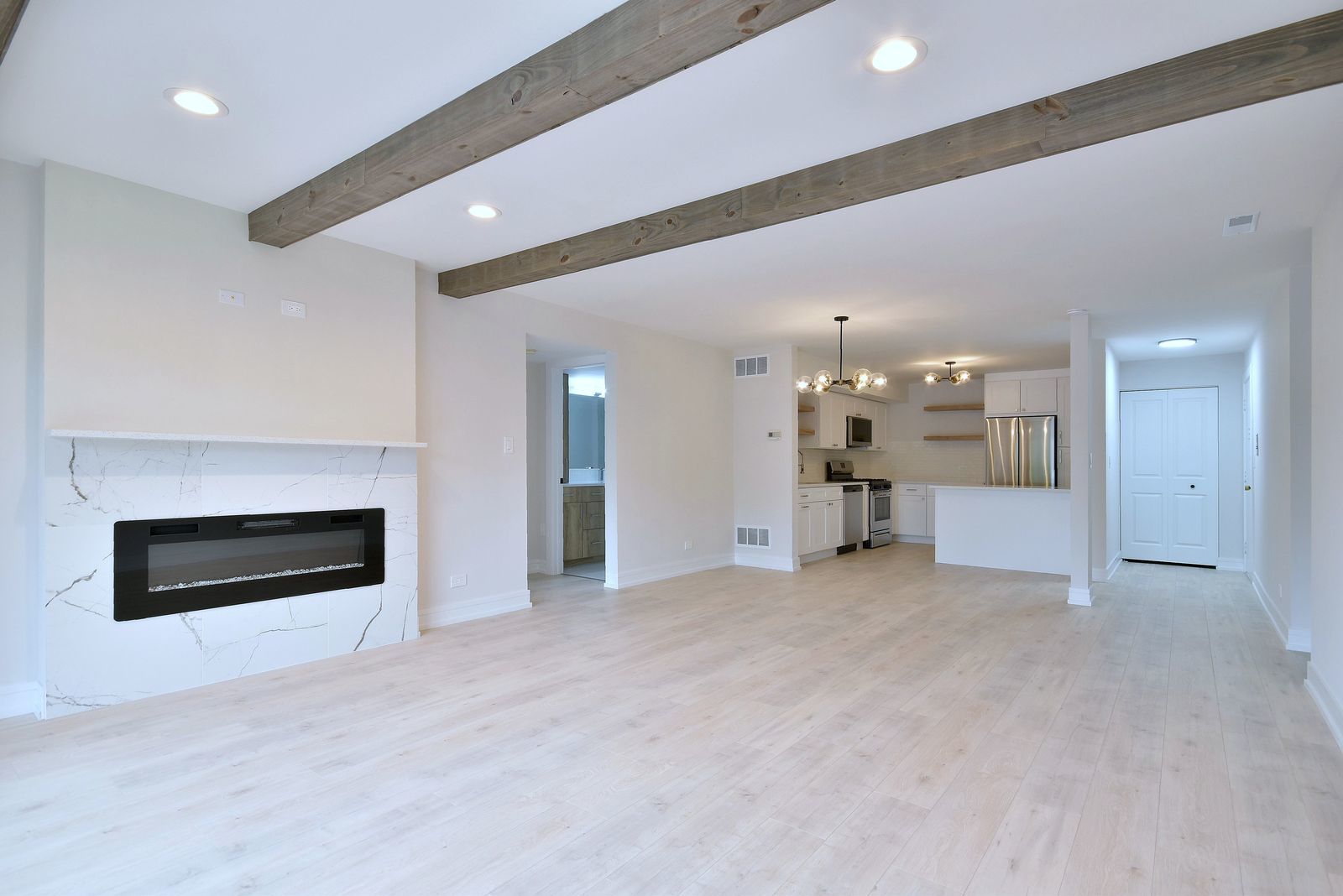7314 Randolph Street, Unit 3G Forest Park, IL 60130 - Photo 4 of 15 a view of an empty room with a fireplace