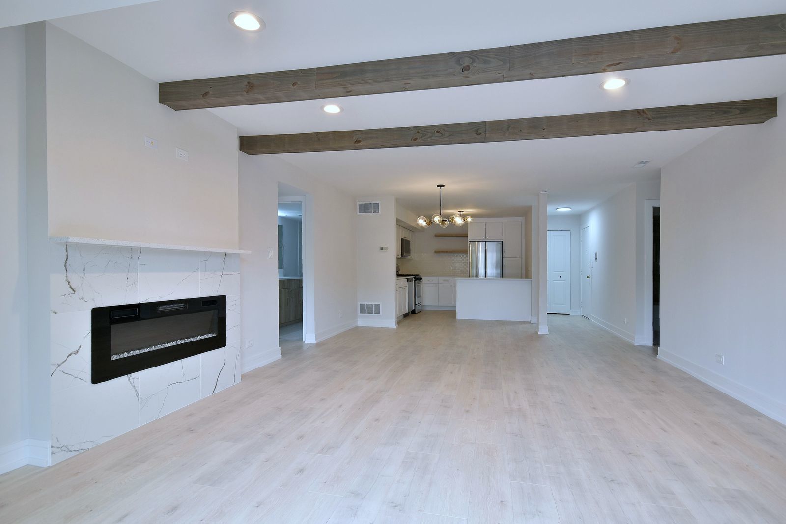 7314 Randolph Street, Unit 3G Forest Park, IL 60130 - Photo 7 of 15 a view of an empty room with a fireplace