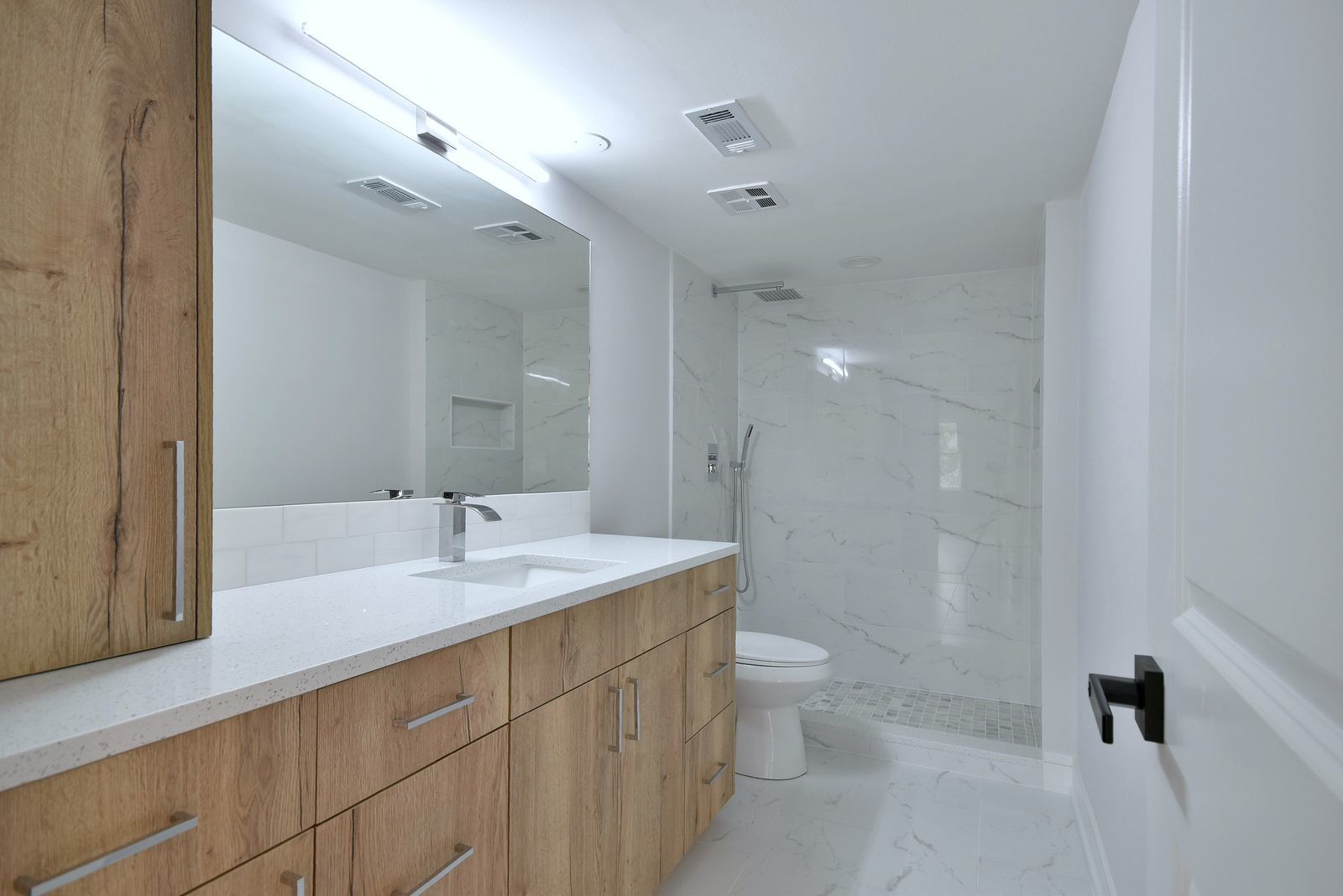 7314 Randolph Street, Unit 3G Forest Park, IL 60130 - Photo 9 of 15 a bathroom with a sink a toilet and shower