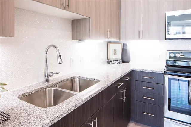 a kitchen with a sink and cabinets