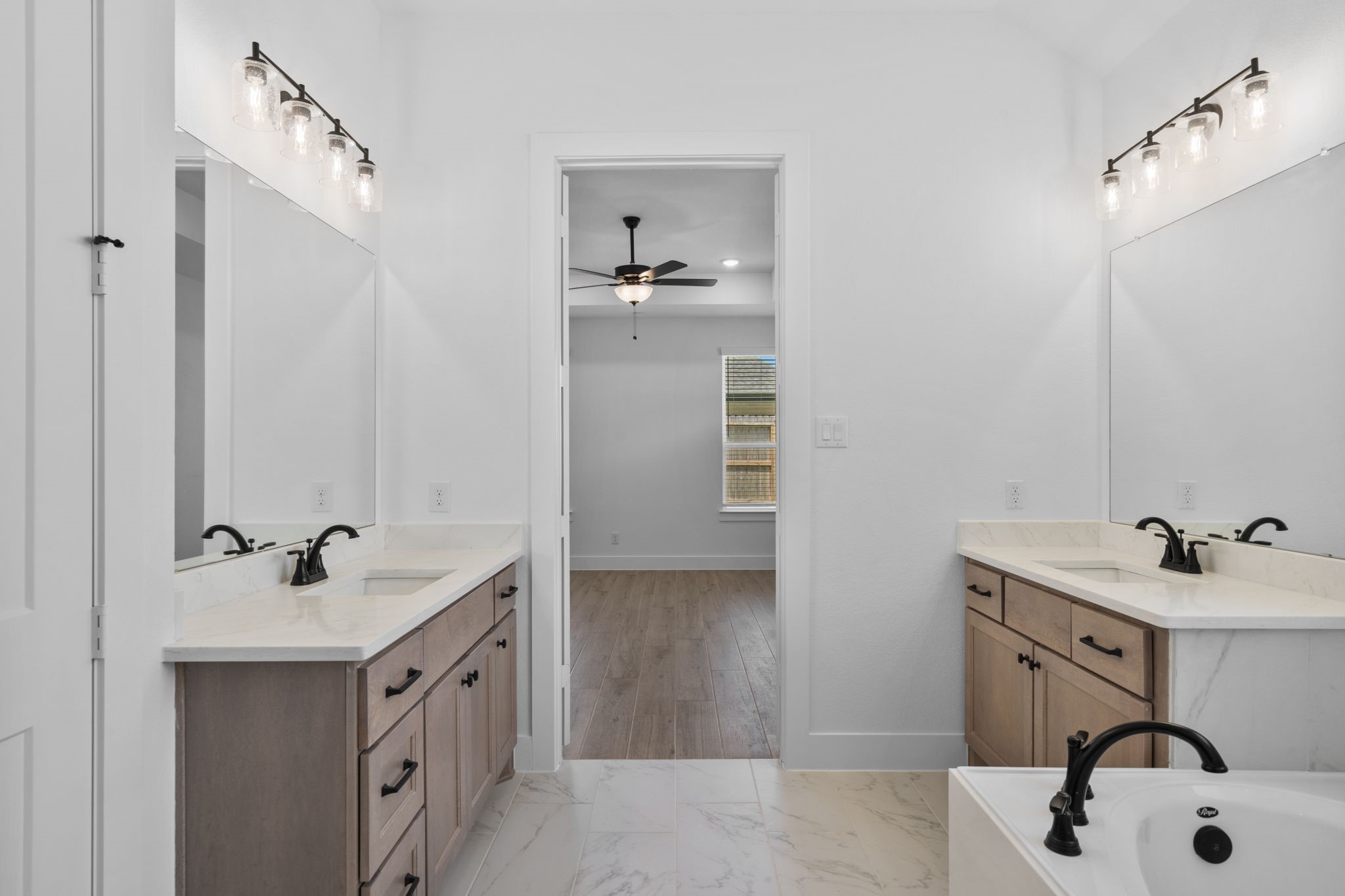 2910 Peach Vly Road Fulshear, TX 77423 - Photo 27 of 35 a bathroom with a sink and a mirror