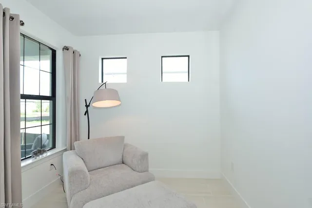 a living room with furniture and window