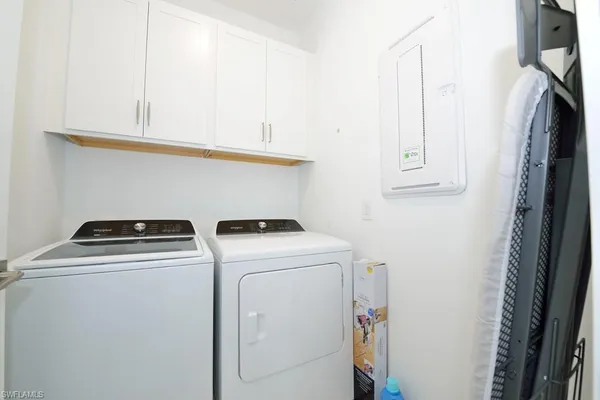 a utility room with dryer and washer