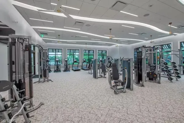 a view of swimming pool with outdoor seating and a garden