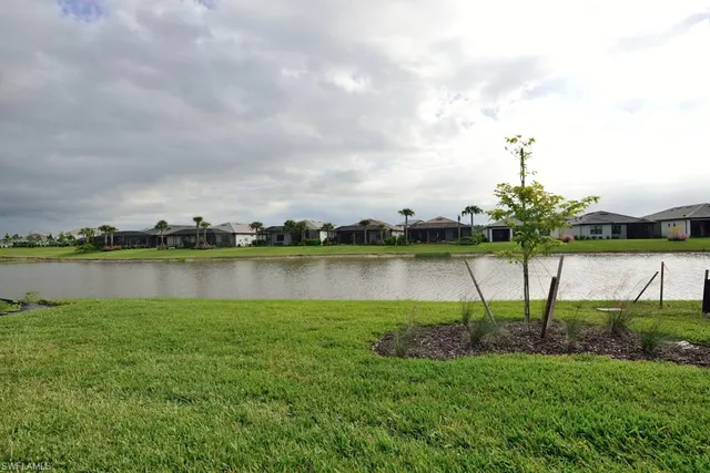 a view of a lake with a big yard