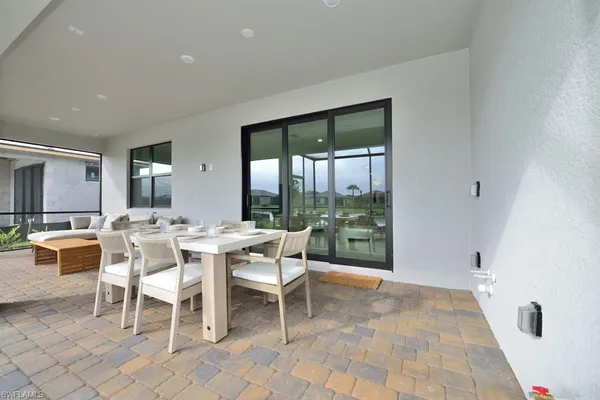 a dining room with a table and chairs