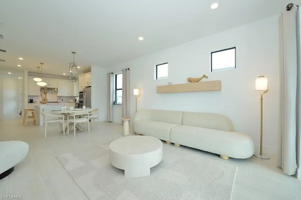 a living room with furniture and a table