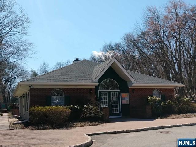 143 Raintree Lane Mahwah, NJ 07430 - Photo 17 of 19 a front view of a house with garden